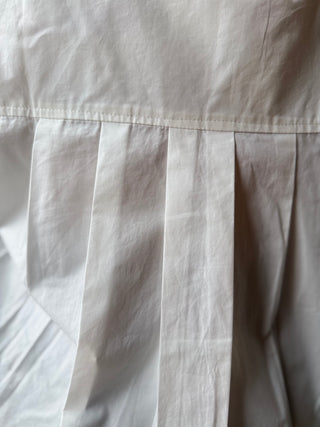 Chemise courte en coton plissée dans le dos